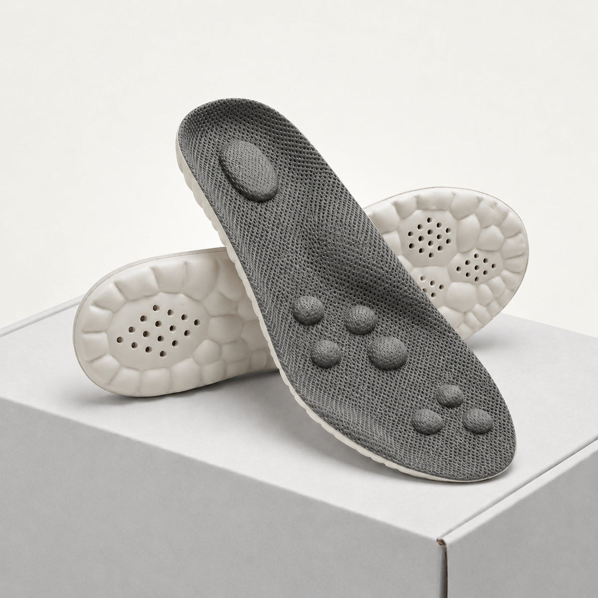 Gray shoe insole with cushioned underside